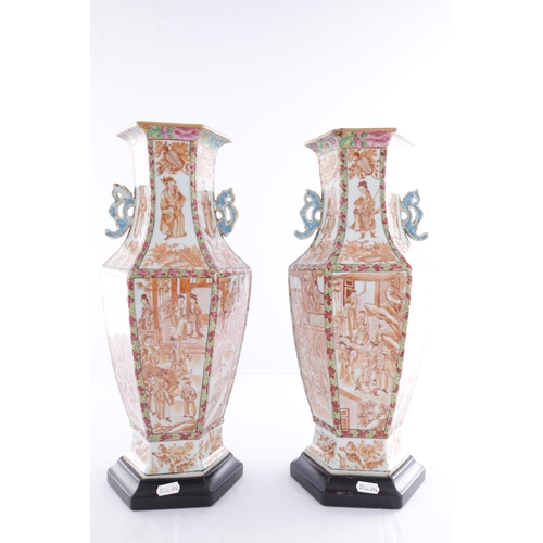 86 - A PAIR OF 18TH CENTURY CANTONESE CHINESE VASES of hexagonal form with shaped side handles, decorated... 