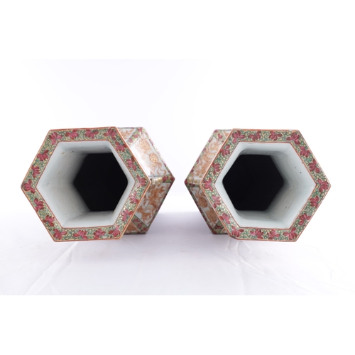 86 - A PAIR OF 18TH CENTURY CANTONESE CHINESE VASES of hexagonal form with shaped side handles, decorated... 