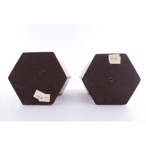 86 - A PAIR OF 18TH CENTURY CANTONESE CHINESE VASES of hexagonal form with shaped side handles, decorated... 