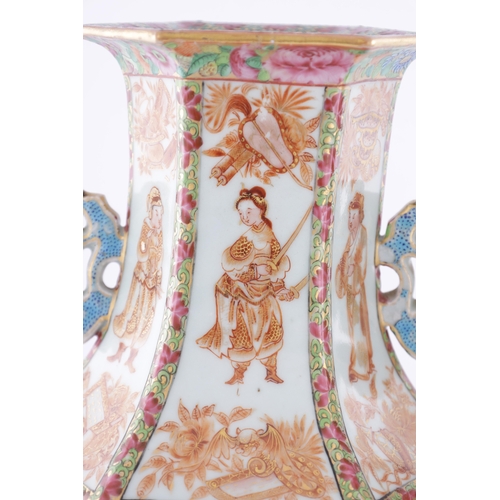 86 - A PAIR OF 18TH CENTURY CANTONESE CHINESE VASES of hexagonal form with shaped side handles, decorated... 