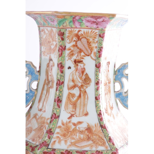 86 - A PAIR OF 18TH CENTURY CANTONESE CHINESE VASES of hexagonal form with shaped side handles, decorated... 