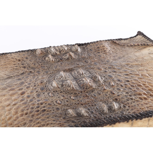 656 - A VINTAGE STITCHED CROCODILE SKIN SUITCASE (51cm side, 16cm deep, 39cm high)