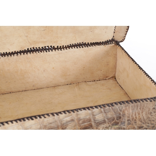 656 - A VINTAGE STITCHED CROCODILE SKIN SUITCASE (51cm side, 16cm deep, 39cm high)