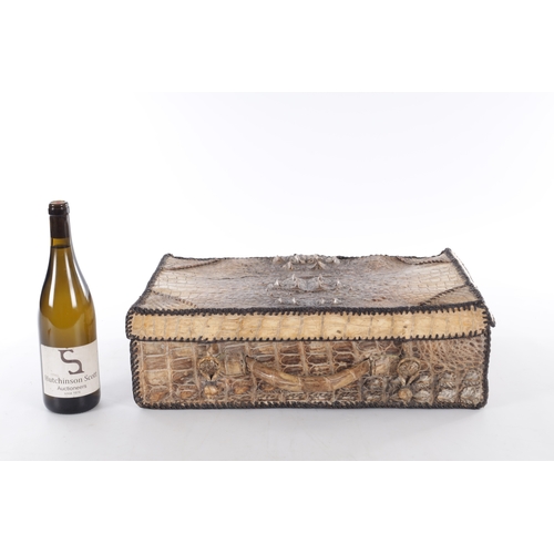 656 - A VINTAGE STITCHED CROCODILE SKIN SUITCASE (51cm side, 16cm deep, 39cm high)