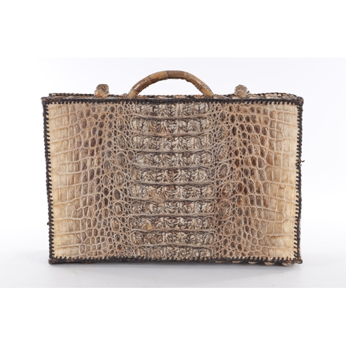 656 - A VINTAGE STITCHED CROCODILE SKIN SUITCASE (51cm side, 16cm deep, 39cm high)