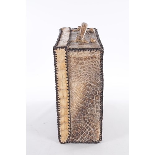 656 - A VINTAGE STITCHED CROCODILE SKIN SUITCASE (51cm side, 16cm deep, 39cm high)
