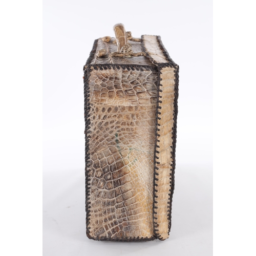 656 - A VINTAGE STITCHED CROCODILE SKIN SUITCASE (51cm side, 16cm deep, 39cm high)