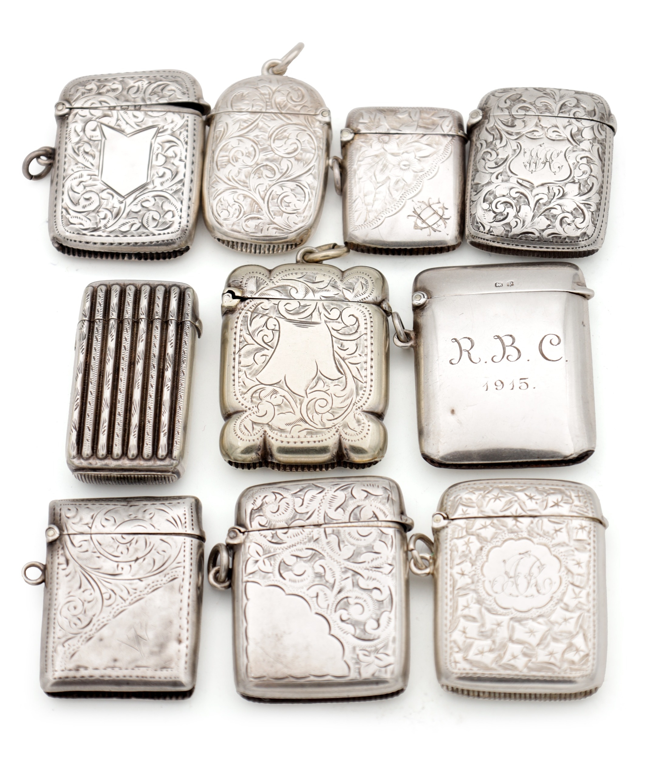 A COLLECTION OF TEN SILVER AND SILVER METAL VESTA CASES comprising ...