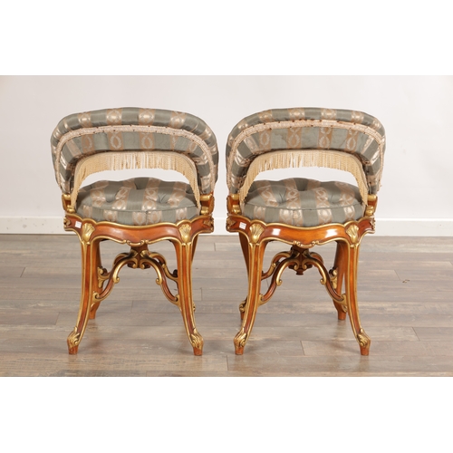 A PAIR OF 19TH CENTURY STYLE FRENCH WALNUT AND PARCEL GILT UPHOLSTERED ...