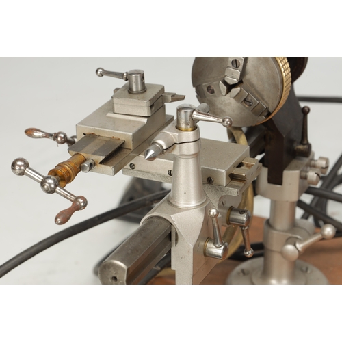 TWO WATCHMAKER'S LATHES AND FITTED MOTOR bench-mounted precision lathes ...