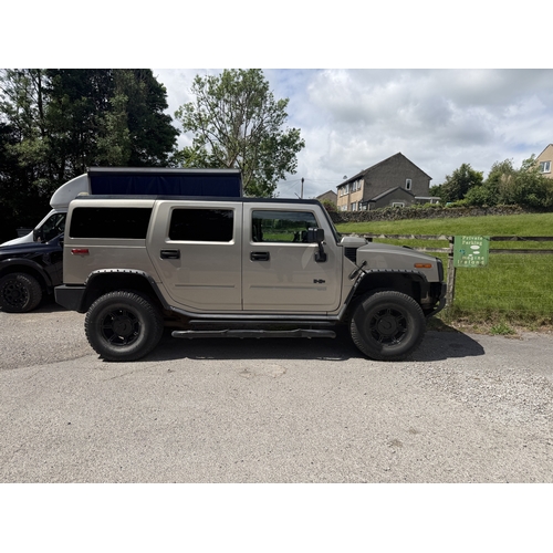 A 2002 HUMMER H2 6 LITRE V8 SUV finished in beige with black wheel arch ...