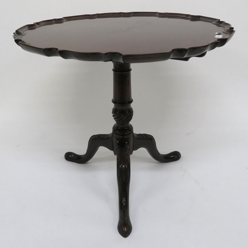 15 - A Victorian mahogany tilt top table on carved tripod base 69cm high x 78cm diameter