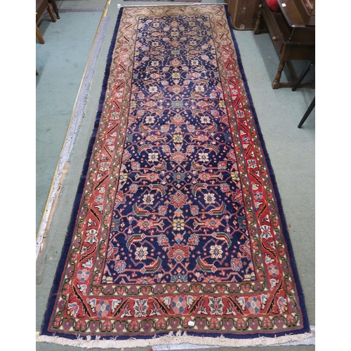 60 - A blue ground Hamedan runner with allover floral design 293cm long x 111cm wide