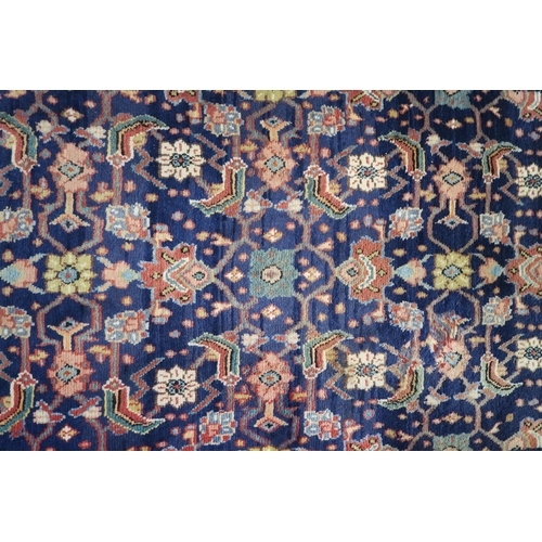 60 - A blue ground Hamedan runner with allover floral design 293cm long x 111cm wide