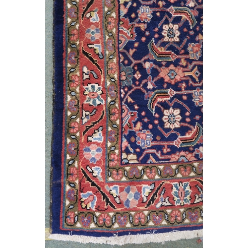 60 - A blue ground Hamedan runner with allover floral design 293cm long x 111cm wide