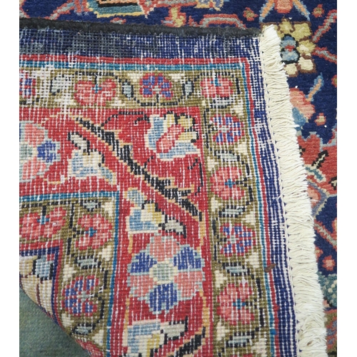 60 - A blue ground Hamedan runner with allover floral design 293cm long x 111cm wide