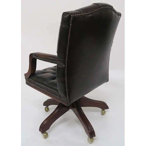 62 - A 20th century button back revolving desk chair 92cm high