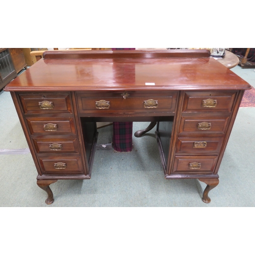 63 - A 20th century mahogany desk on cabriole supports 82cm high x 107cm wide x 47cm deep