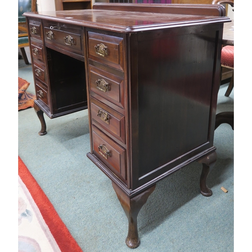 63 - A 20th century mahogany desk on cabriole supports 82cm high x 107cm wide x 47cm deep