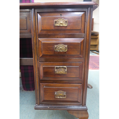 63 - A 20th century mahogany desk on cabriole supports 82cm high x 107cm wide x 47cm deep