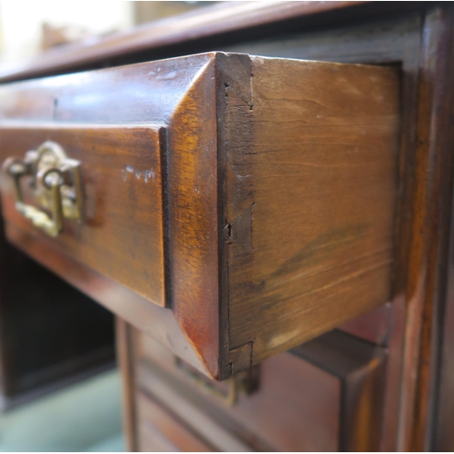 63 - A 20th century mahogany desk on cabriole supports 82cm high x 107cm wide x 47cm deep