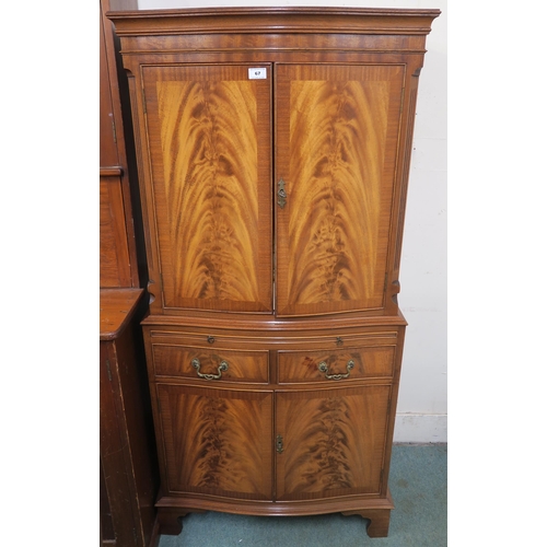 67 - A 20th century mahogany drinks cabinet 153cm high x 72cm wide x 46cm deep