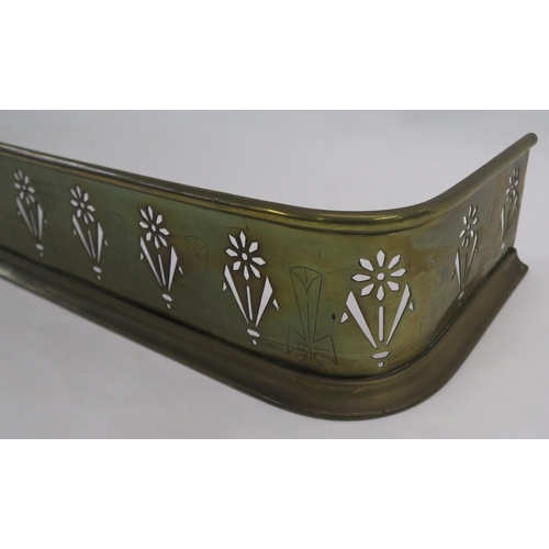 69 - An early 20th century arts and crafts brass fire fender pierced with stylised flowers, 16cm high, 14... 