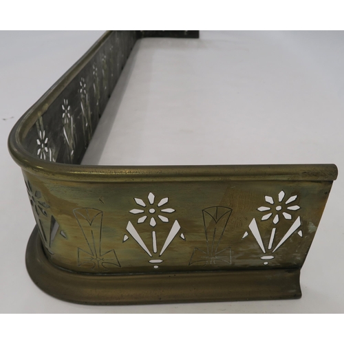 69 - An early 20th century arts and crafts brass fire fender pierced with stylised flowers, 16cm high, 14... 