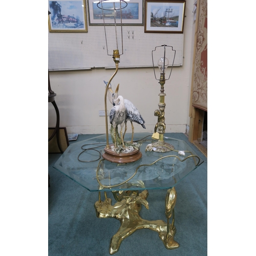 71 - A 20th century oriental style brass bird based glass top lamp table,an oriental circular brass top t... 