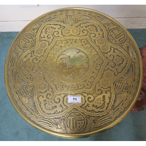 71 - A 20th century oriental style brass bird based glass top lamp table,an oriental circular brass top t... 