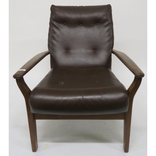 76 - A mid 20th century Cintique teak framed armchair with brown vinyl upholstery