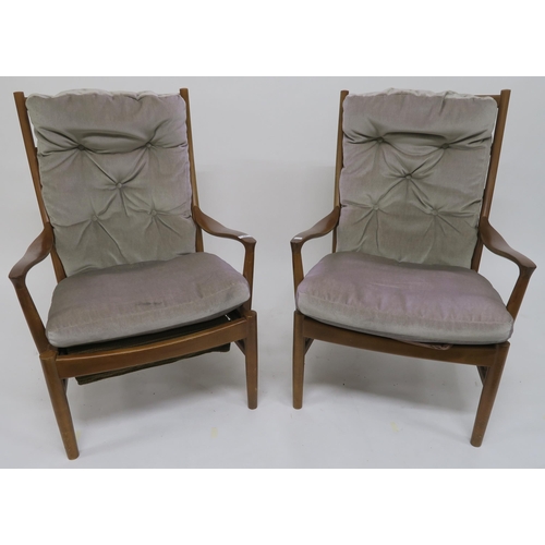 82 - A pair of mid 20th century teak framed Parker Knoll armchairs (2)