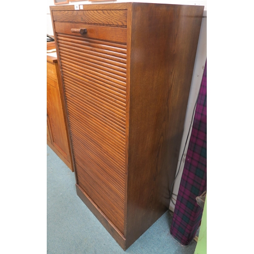 86 - A 20th century oak tambour front filing cabinet 152cm high x 66cm wide x 52cm deep