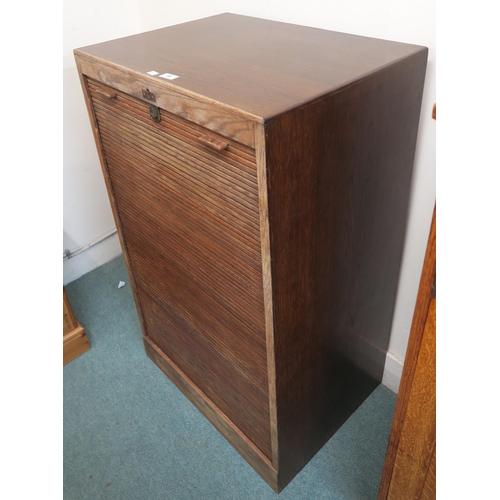 90 - A 20th century oak tambour front filing cabinet 111cm high x 66cm wide x 50cm deep