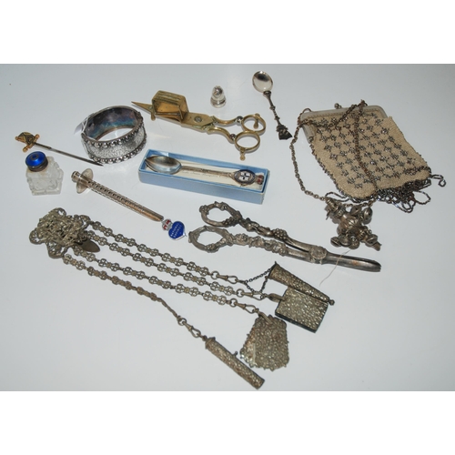 791 - A lot comprising a white-metal chatelaine, part baby rattle, grape scissors, snuffers, bangle etc