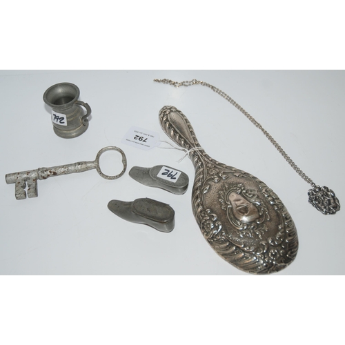 792 - A lot comprising a silver-backed hair brush, Birmingham 1902, a large key measure, white-metal penda... 