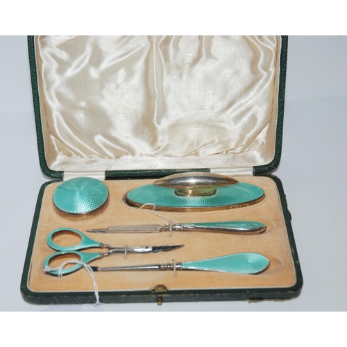 793 - A cased five-piece silver and enamel manicure set, Birmingham 1925