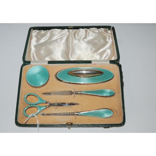 793 - A cased five-piece silver and enamel manicure set, Birmingham 1925