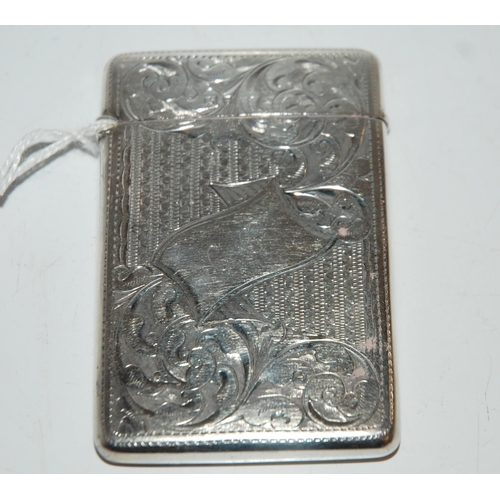 797 - A silver card case, Birmingham 1904, rectangular with foliate engraved decoration, the cartouche mon... 