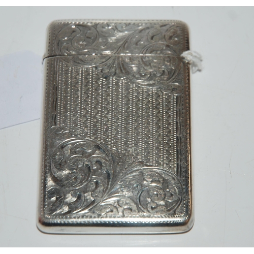 797 - A silver card case, Birmingham 1904, rectangular with foliate engraved decoration, the cartouche mon... 