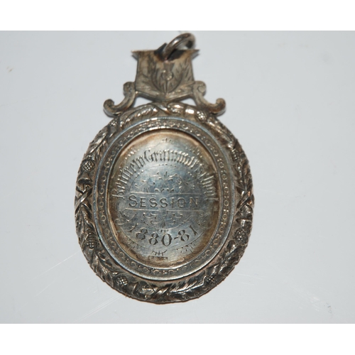 809 - An oval silver academic medallion Renfrew Grammar School 1880-81 to Miss Isabella R Stewart 8 cm x 5... 