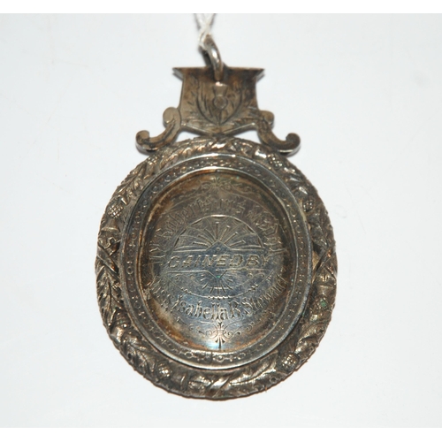 809 - An oval silver academic medallion Renfrew Grammar School 1880-81 to Miss Isabella R Stewart 8 cm x 5... 