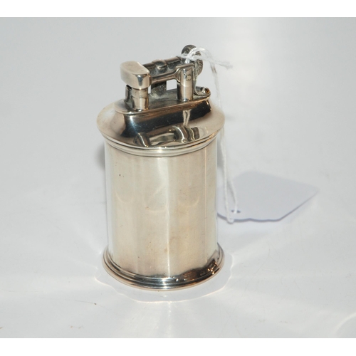 810 - A silver cased cigarette lighter Birmingham 1929, 4.2 cm dia, 8 cm high