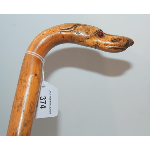 374 - A walking cane, the head modelled as a dog's head