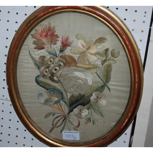 393 - An embroidered picture of a lady and a similar example still life (2)