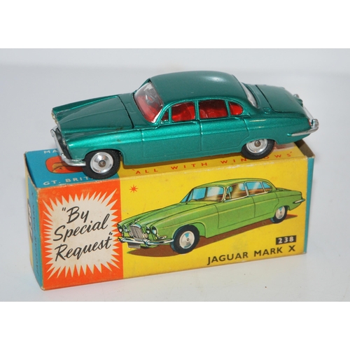 398 - A Corgi No. 238 Jaguar Mk X comprising of metallic sea green body with red interior and spun hubs, i... 