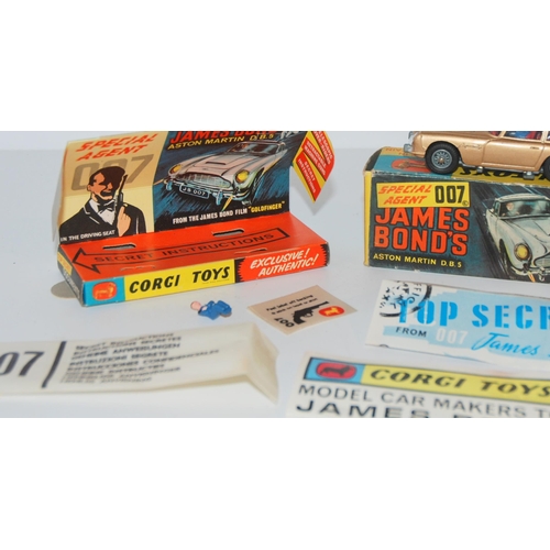 401 - A Corgi 261 James Bond Aston Martin D.B.5 from “Goldfinger” gold body, complete with sea... 