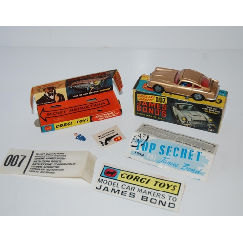 401 - A Corgi 261 James Bond Aston Martin D.B.5 from “Goldfinger” gold body, complete with sea... 