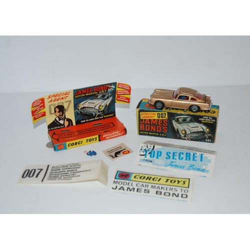 401 - A Corgi 261 James Bond Aston Martin D.B.5 from “Goldfinger” gold body, complete with sea... 