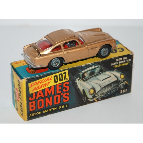 401 - A Corgi 261 James Bond Aston Martin D.B.5 from “Goldfinger” gold body, complete with sea... 